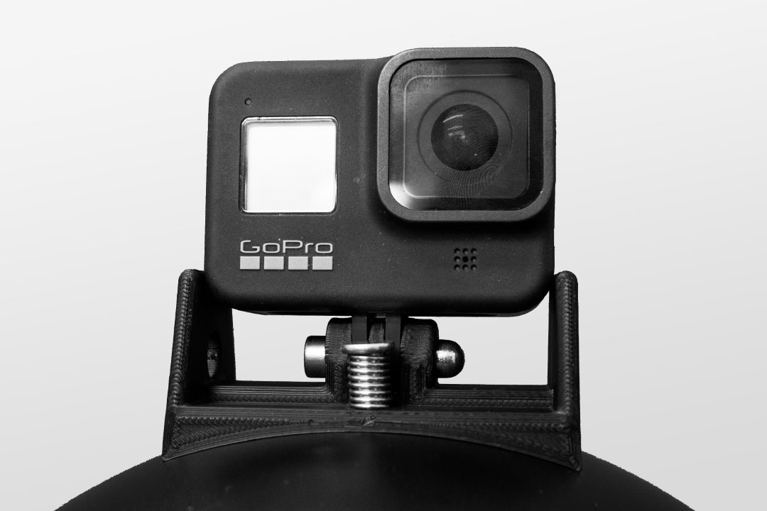 Image of the GoPro 8 Cookie G4 cutaway mount on top of a black cookie g4